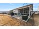 Private backyard with patio, screened porch, and grilling area at 212 War Admiral Dr, Clayton, NC 27520