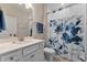 Bathroom with floral shower curtain and white vanity at 212 War Admiral Dr, Clayton, NC 27520
