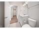 Bathroom featuring white cabinets and vanity sink and a toilet at 212 War Admiral Dr, Clayton, NC 27520