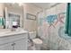 Clean bathroom with a white vanity and starfish-themed decor at 212 War Admiral Dr, Clayton, NC 27520
