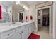Double vanity bathroom with walk-in closet and marble shower at 212 War Admiral Dr, Clayton, NC 27520