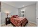 Cozy bedroom with full-size bed and nightstand at 212 War Admiral Dr, Clayton, NC 27520