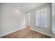 Cozy bedroom featuring wood floors, neutral walls, and a large window with great natural light at 212 War Admiral Dr, Clayton, NC 27520