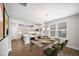Open-concept dining area with view into the kitchen, offering seating for six and stylish decor at 212 War Admiral Dr, Clayton, NC 27520