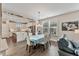 Kitchen and dining area with an island, stainless steel appliances, and hardwood floors at 212 War Admiral Dr, Clayton, NC 27520
