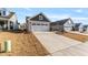Row of houses showcasing attached garages and neat lawns at 212 War Admiral Dr, Clayton, NC 27520