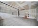 Unfinished two-car garage with concrete flooring, drywall, and a garage door opener ready to be customized at 212 War Admiral Dr, Clayton, NC 27520