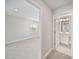 Hallway view into carpeted bedroom and bathroom with vanity and tile flooring at 212 War Admiral Dr, Clayton, NC 27520