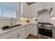 Modern kitchen with stainless steel appliances and white cabinetry at 212 War Admiral Dr, Clayton, NC 27520