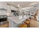 Modern kitchen with white cabinets, quartz countertops, and stainless steel appliances at 212 War Admiral Dr, Clayton, NC 27520