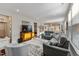 Spacious living room with leather sofas and large windows providing natural light at 212 War Admiral Dr, Clayton, NC 27520