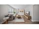 Inviting living room with hardwood floors, neutral decor, and ample natural light at 212 War Admiral Dr, Clayton, NC 27520