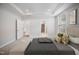 Beautiful main bedroom featuring a tray ceiling and ensuite bathroom access at 212 War Admiral Dr, Clayton, NC 27520
