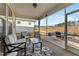 Relaxing screened porch with seating area and view of backyard at 212 War Admiral Dr, Clayton, NC 27520