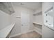 Walk-in closet with storage shelves and hanging rods at 212 War Admiral Dr, Clayton, NC 27520