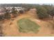Aerial view of the golf course and some homes in the community, offering a glimpse of the surrounding landscape at 2321 Turtle Point Dr, Raleigh, NC 27604
