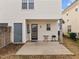 Home's backyard with a small patio area, ideal for outdoor dining and enjoying the peaceful surroundings at 2321 Turtle Point Dr, Raleigh, NC 27604