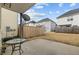Covered patio features table, grill, and partial view of backyard and surrounding houses at 2321 Turtle Point Dr, Raleigh, NC 27604