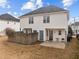 The home's backyard features a covered patio and ample space for outdoor entertaining and relaxation at 2321 Turtle Point Dr, Raleigh, NC 27604