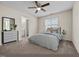 Cozy bedroom with a comfortable bed, side table, dresser and a view of the bathroom at 2321 Turtle Point Dr, Raleigh, NC 27604