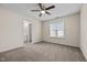 Spacious bedroom with a ceiling fan and a large window, offering a bright and airy atmosphere at 2321 Turtle Point Dr, Raleigh, NC 27604