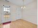 Cozy dining area with a back door with access to the backyard and a light fixture at 2321 Turtle Point Dr, Raleigh, NC 27604