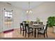 Dining room featuring a door to the backyard, dining table, and a large potted plant at 2321 Turtle Point Dr, Raleigh, NC 27604