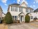 Inviting two-story home with a well-manicured lawn, complemented by vibrant green shrubs at 2321 Turtle Point Dr, Raleigh, NC 27604