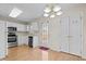Cozy kitchen with stainless steel appliances, white cabinetry and access to backyard at 2321 Turtle Point Dr, Raleigh, NC 27604