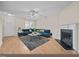Bright living room featuring a fireplace and a comfortable, contemporary blue sectional sofa at 2321 Turtle Point Dr, Raleigh, NC 27604