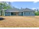 The backyard is spacious, with ample room for recreation and outdoor activities around this lovely home at 260 Ellington Rd, Graham, NC 27253
