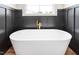 Close-up of freestanding tub with gold hardware at 260 Ellington Rd, Graham, NC 27253