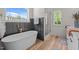 Modern bathroom with stand-alone tub and walk-in shower at 260 Ellington Rd, Graham, NC 27253