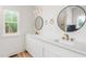 Bright bathroom with double vanity and matte gold accents at 260 Ellington Rd, Graham, NC 27253