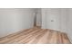 Spacious bedroom featuring hardwood floors, closet and doors at 260 Ellington Rd, Graham, NC 27253
