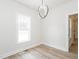 Cozy room with a large window and modern lighting fixture at 260 Ellington Rd, Graham, NC 27253