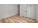 Spacious bedroom featuring hardwood floors, closet and doors at 260 Ellington Rd, Graham, NC 27253