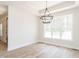 Bright dining area with contemporary chandelier and large window with natural light at 260 Ellington Rd, Graham, NC 27253