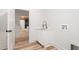 Laundry room with white cabinets, gold faucet, and hookups for a washer and dryer at 260 Ellington Rd, Graham, NC 27253