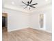 Bright bedroom featuring tray ceilings, a fan, recessed lighting, and an ensuite bathroom at 260 Ellington Rd, Graham, NC 27253