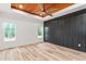 Spacious main bedroom with wood ceiling, fan, two windows, and wainscoting at 260 Ellington Rd, Graham, NC 27253