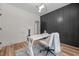 Bright home office featuring modern lighting, stylish desk, and ample storage at 260 Ellington Rd, Graham, NC 27253