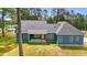 Rear exterior of a blue home featuring a covered back porch with brick steps and wooden supports offering outdoor charm at 260 Ellington Rd, Graham, NC 27253