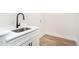 Modern sink with white cabinets and stylish black faucet at 260 Ellington Rd, Graham, NC 27253