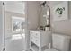 Clean bathroom with a white vanity, toilet, and arched mirror at 3 Patriot Cir, Durham, NC 27704