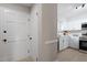 Bright entryway with white door and view into the kitchen at 3 Patriot Cir, Durham, NC 27704