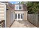 Back of townhouse with private patio and wooden fence at 3 Patriot Cir, Durham, NC 27704