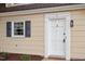 Updated townhouse front door and window at 3 Patriot Cir, Durham, NC 27704