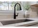 Close up of the kitchen sink area with decorative elements at 3 Patriot Cir, Durham, NC 27704
