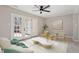 Bright living room with modern furniture, light wood floors, and French doors at 3 Patriot Cir, Durham, NC 27704